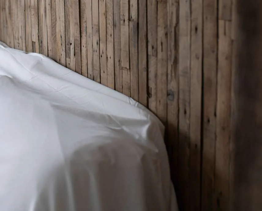 White linen against a wall of weathered wood